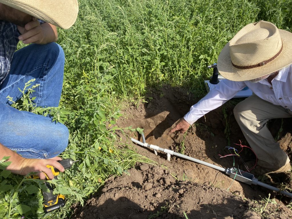 Installing soil moisture monitors at the Vannoy Ranch in Greenough.